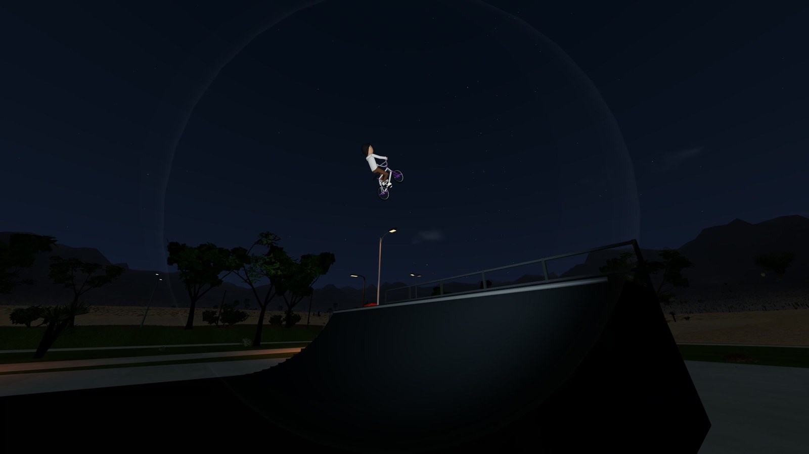 A BMX rider catching air above the mega ramp at night